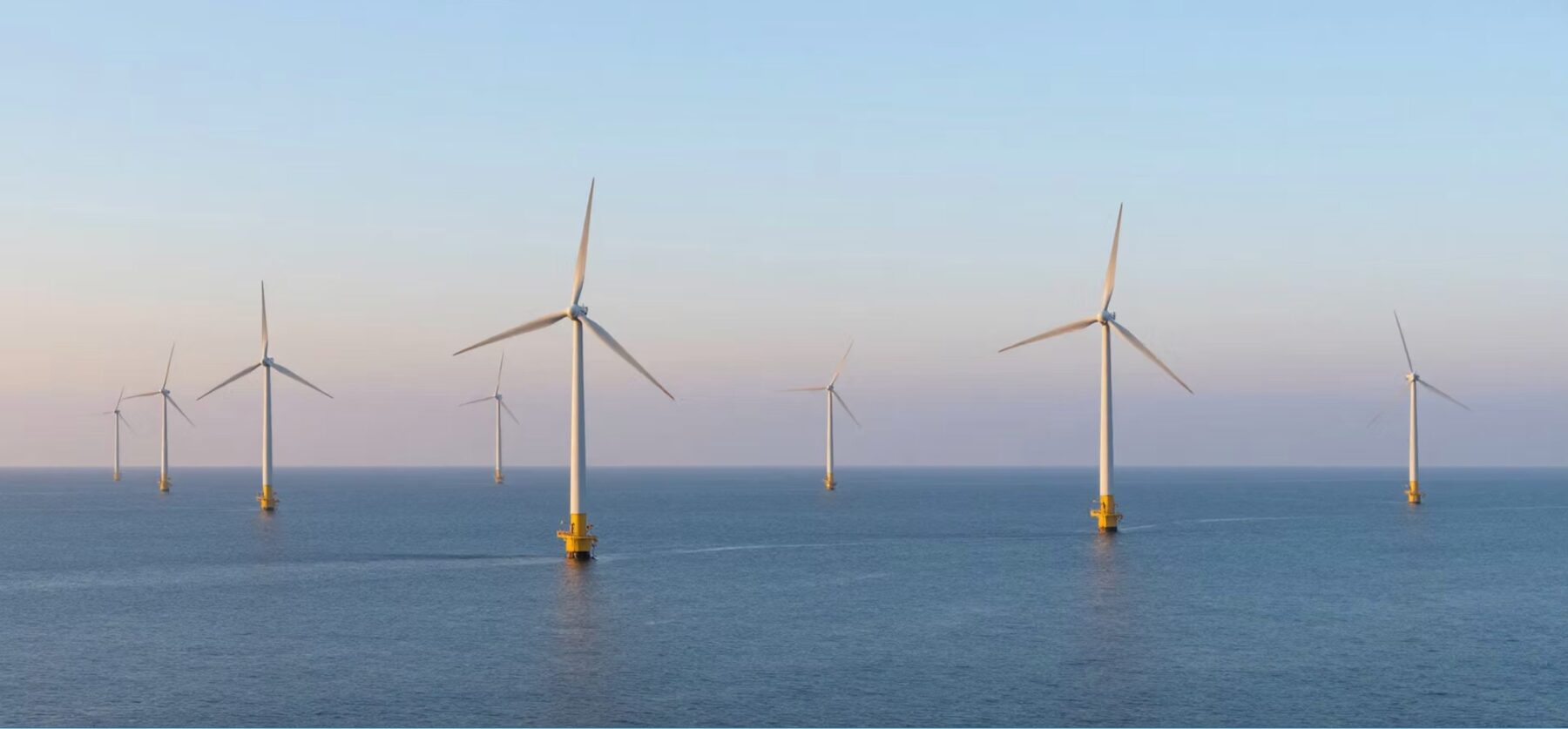 Offshore wind turbines at sunset